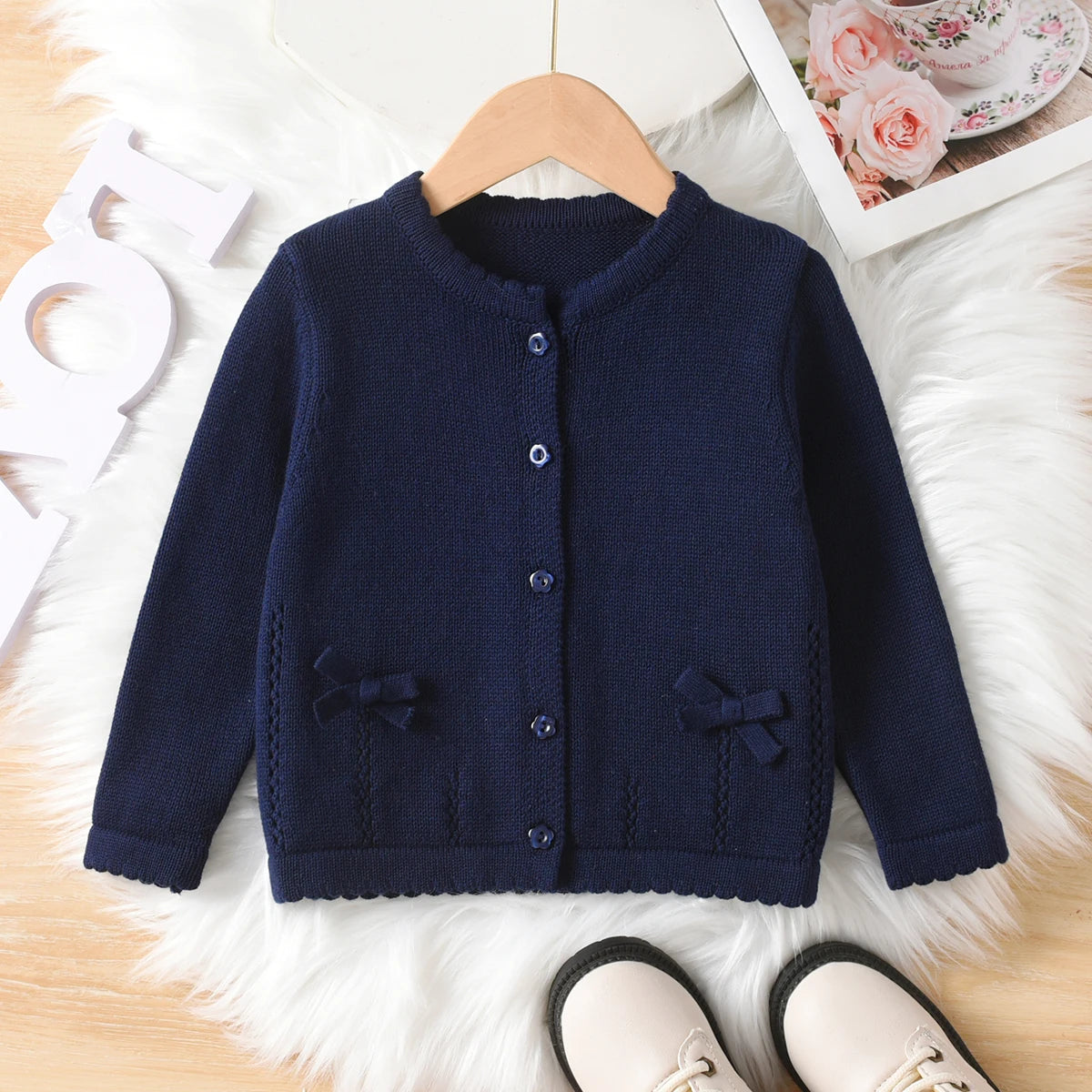 Girl's cute solid color bow round neck sweater cardigan suitable for casual vacation in spring, autumn, and winter